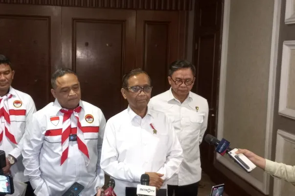 Menkopolhukan Mahfud MD saat menghadiri acara pelepasan Pekerja Migran Indonesia (PMI) ke Korea dan Jepang di Menara Peninsula, Jakarta Barat, Senin (19/6/2023). (Pandi)