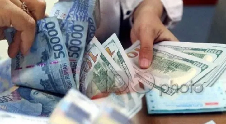 Ilustrasi mata uang rupiah terhadap dolar AS. (ist)