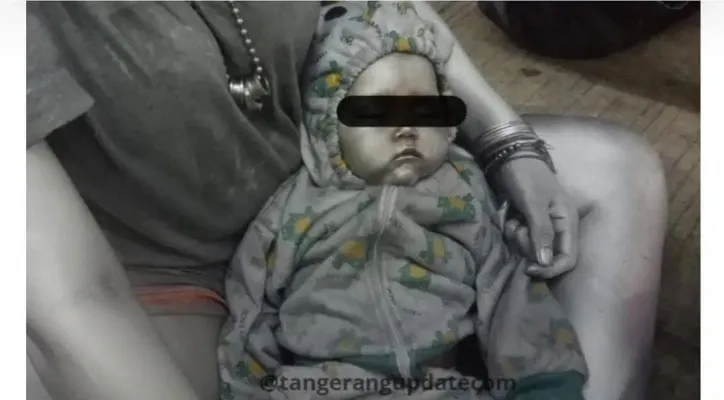 Foto viral bayi 10 bulan dijadikan "manusia silver" di Tangerang Selatan. (foto/screenshot @tangsel_upadet)