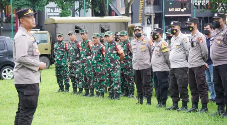 Apel personel gabungan untuk pengamanan PAMSEA PNLG. (foto: poskota/veronica)