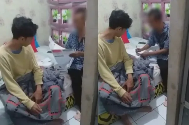 Seorang yang diduga oknum petugas KPPS (kanan) di Pandeglang saat mencobloskan surat suara orang sakit. (Foto: tangkapan layar video).